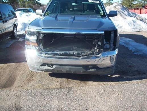 Damaged GMC Sierra 1500 missing front grille and headlights