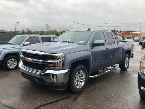 GMC Sierra 1500 parked in a lot on rainy day