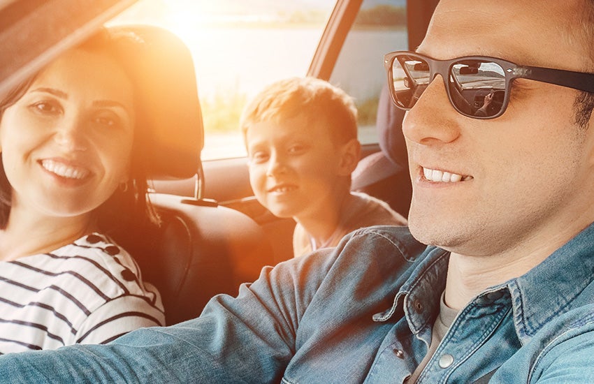 Family driving a car